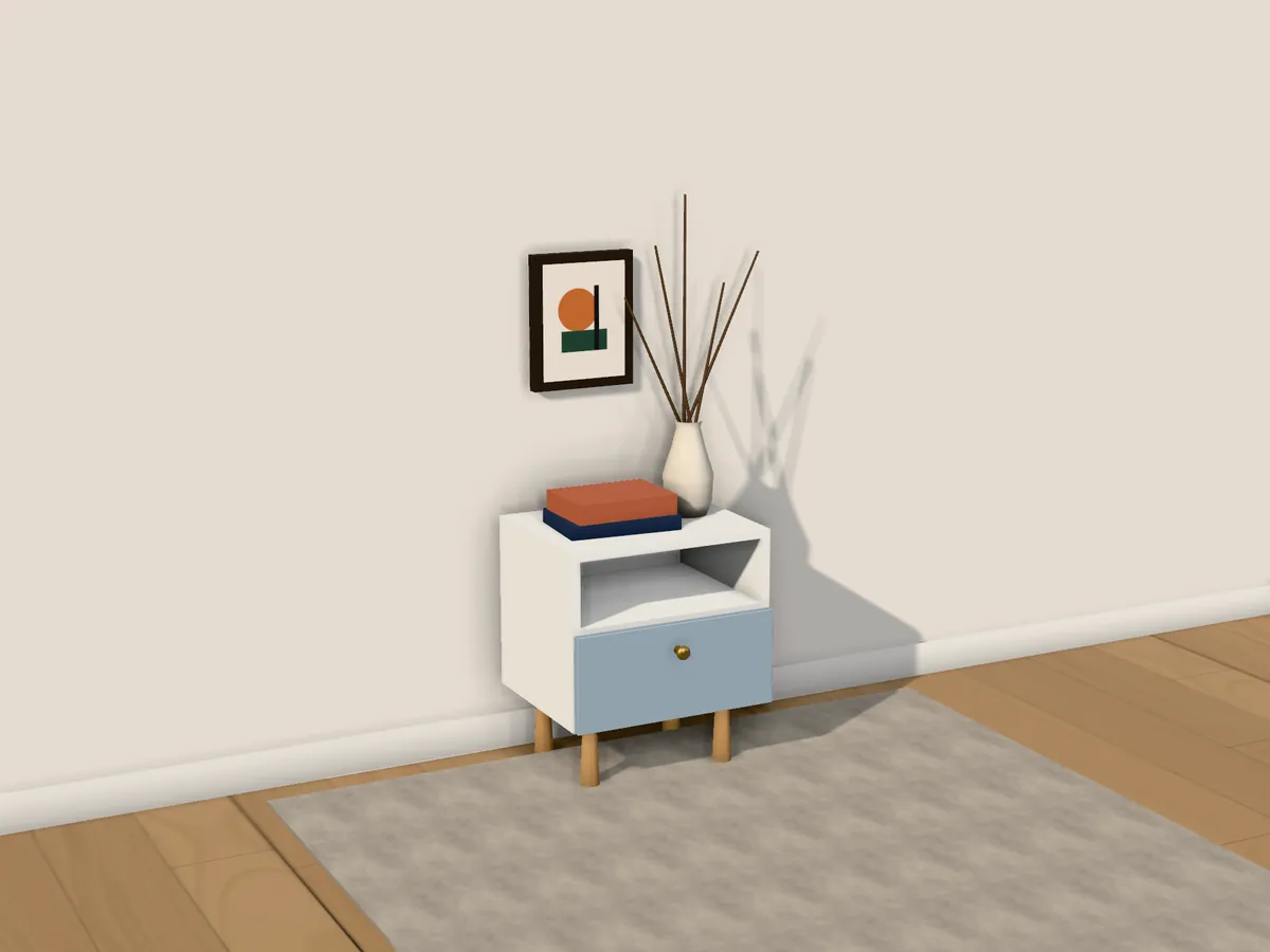 A misty blue bedside table with a brass knob